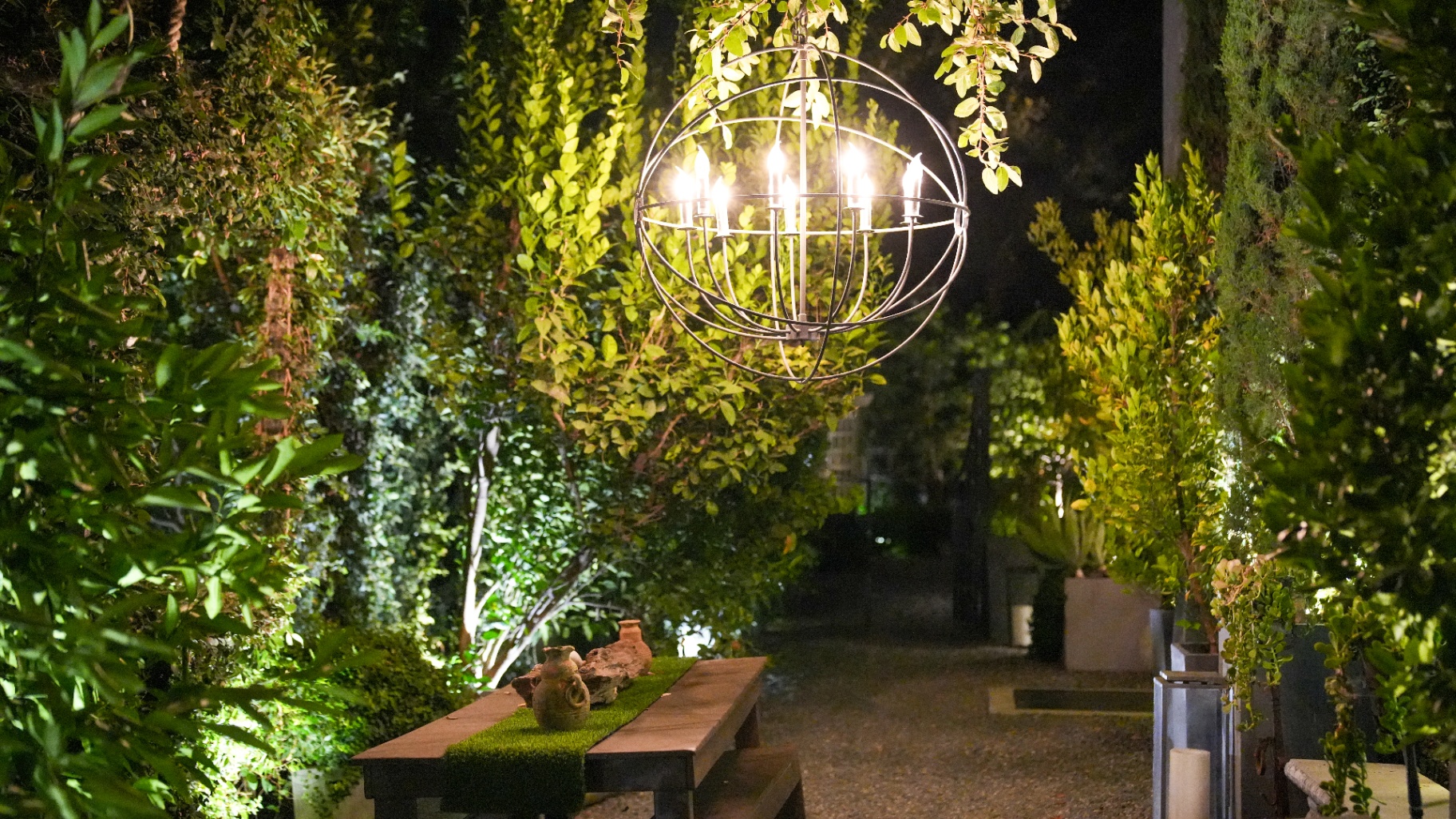 Candlelit garden entrance with lantern chandelier
