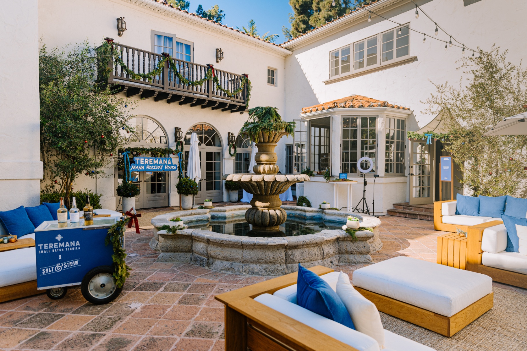 Teremana Holiday House courtyard with fountain and Salt & Straw cart