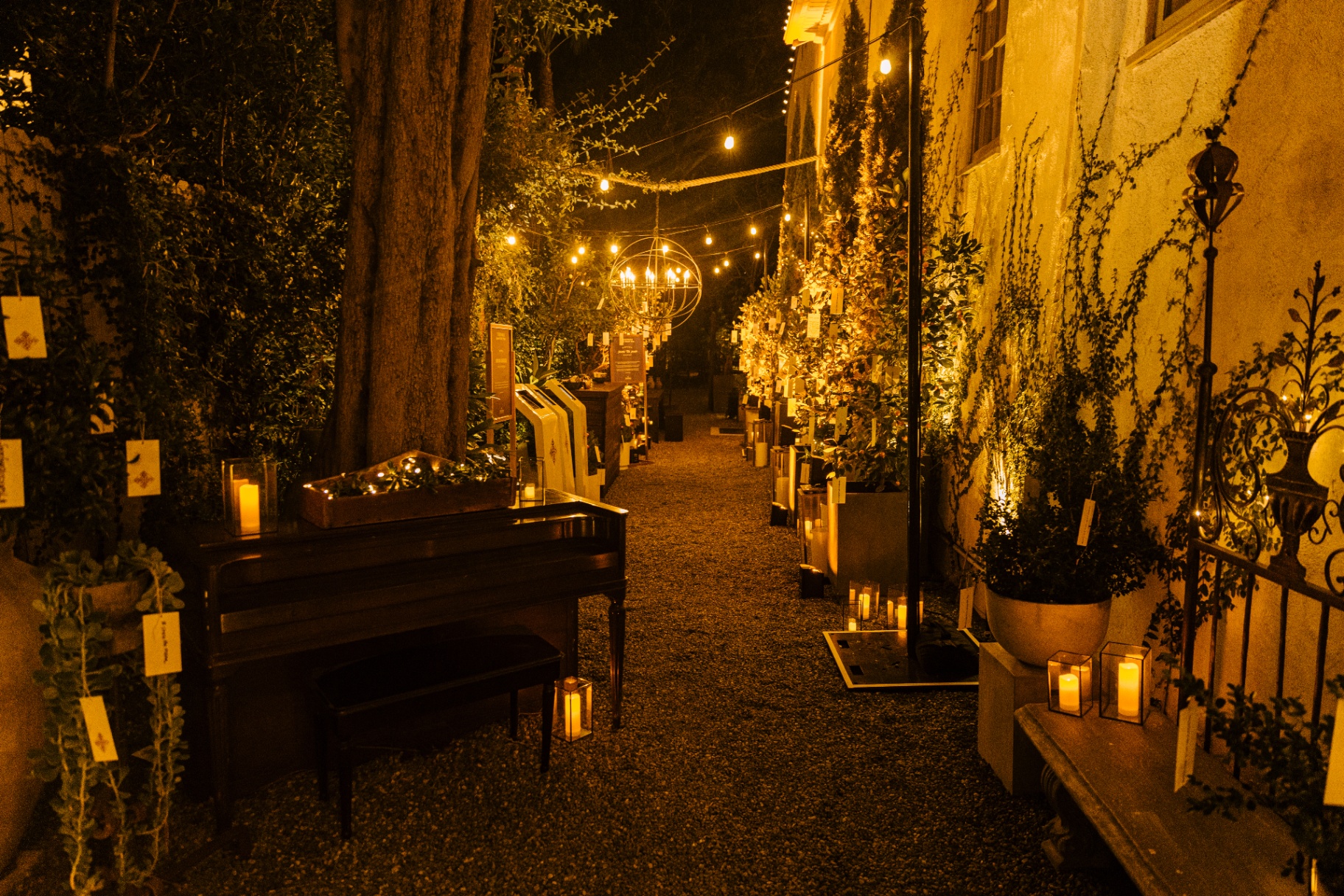 Candlelit garden pathway lined with lanterns