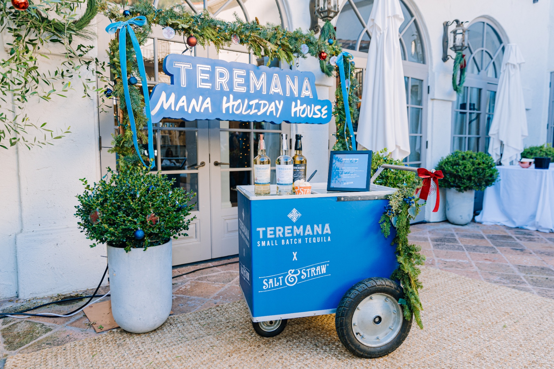 Teremana x Salt & Straw ice cream cart with holiday signage