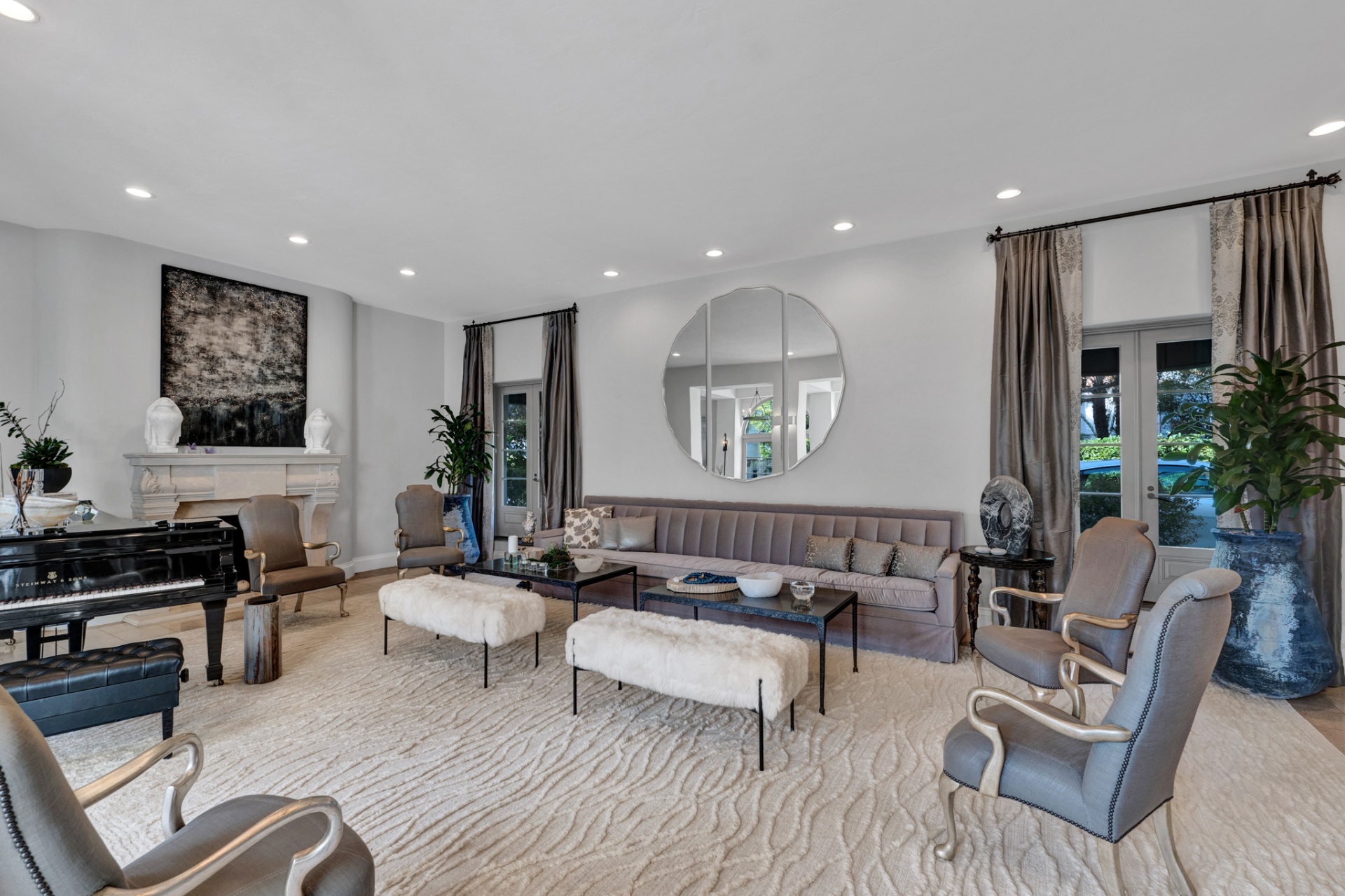Living room seating area with Steinway grand piano